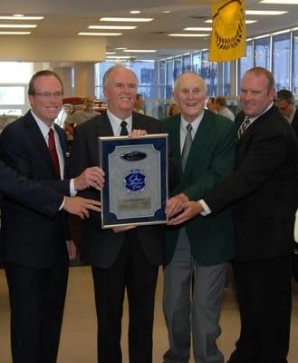 Jim, Bill, Jack and Matt Demmer receiving the award for Ford's Top 100 Club.