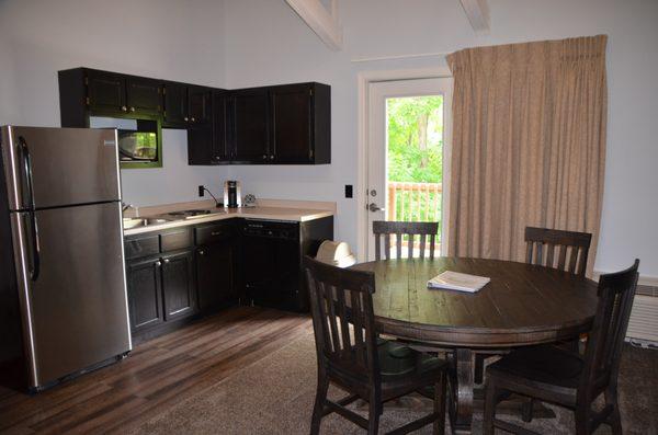 The kitchen in the Presidential suite provides space to enjoy family meals with access to a lake-facing patio.