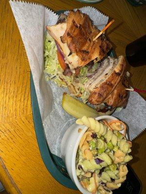 The Vinny with roast beef on a toasted croissant with a side of pasta salad