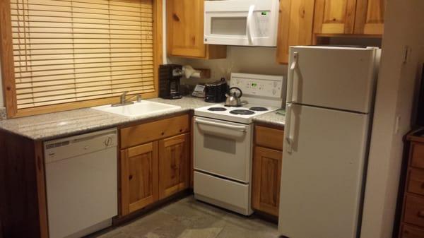 Kitchenette in our 1 bdrm. Stocked with all amenities you could need.