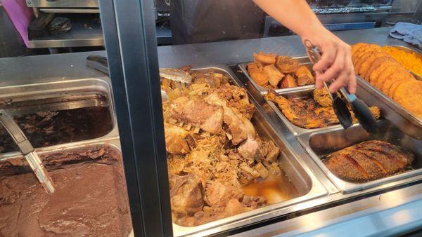 Pork shoulder,  fried fish, chicken leg, potato pancakes