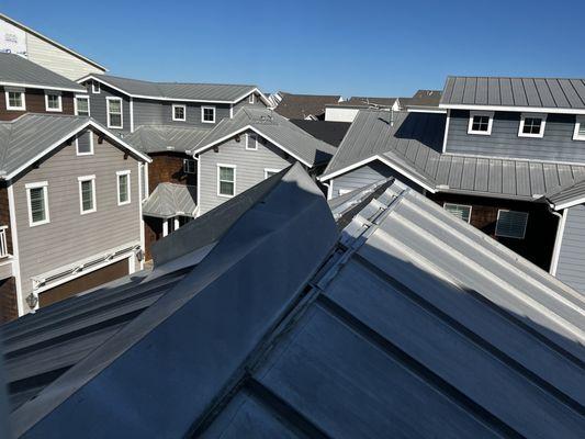 Metal roofing bent by winds