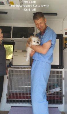 Rusty is so relaxed with Dr. Brad and loves him!