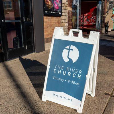 Our sign outside The Falls Theatre showing we are open for worship!