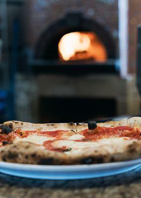 Our pizzas are cooked in a scorching 900 degree wood-fired oven for 90 seconds. Enjoy the freshest, most authentic Neapolitan pizza!