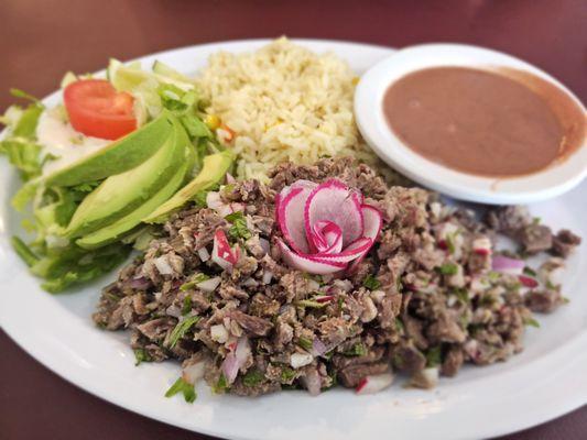 Carne deshilada - shredded beef, beans, and salad