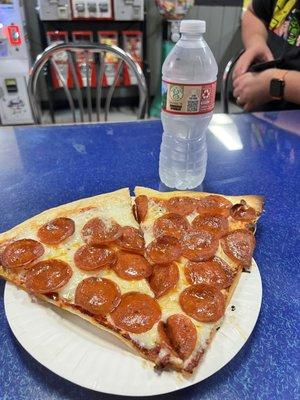 Pepperoni and cheese pizza by the slice