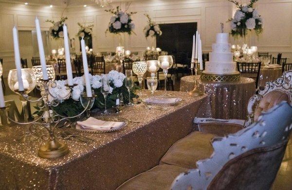 Tall centerpieces and sweetheart table arrangement