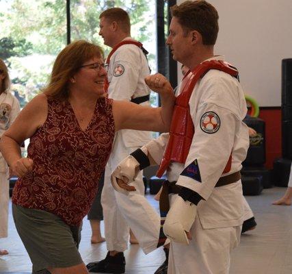 Having a blast gaining skill and confidence at one of Bennati's Martial Arts' free women's self defense classes!