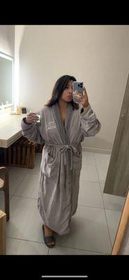 In comfy robe and slippers!