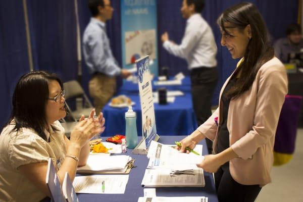 Student talks to recruiter at ITU Career Fair