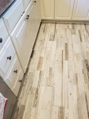 How beautiful is this porcelain tile?  Looks great in this farmhouse kitchen!