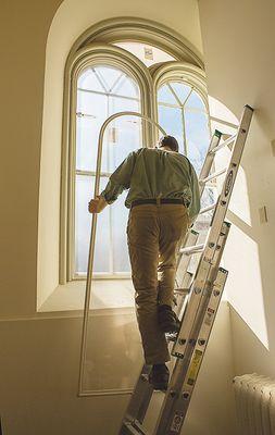 Installation of custom-made Indow insert for an arched window. Bowdoin College, Maine.