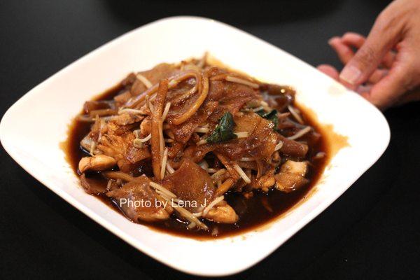 Drunken Noodles with Chicken ($10.95) - wide rice noodles stir fried together with eggs, bamboo, onions, Thai basil, and beansprouts