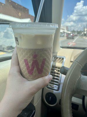 Smaller sized iced latte with chocolate fudge and peanut butter flavor add-ins