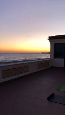 Yoga with Kylie by the beach at sunset