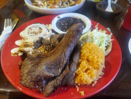 Tampiquena Oaxaca Style - an amazing platter of mole enchiladas, sope, and big ass piece of carne asada, with rice and beans