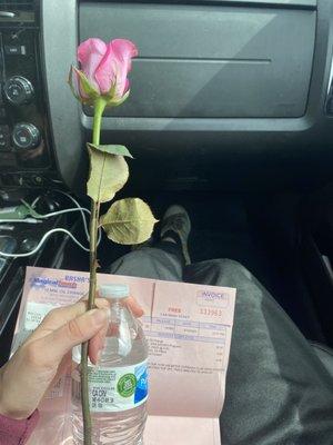 Rose for mums day, coupon for free car wash, cold bottled water.