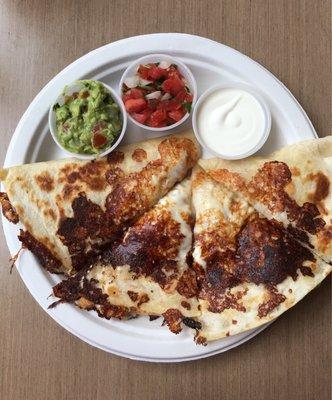 Delicious Chicken quesadilla with small side quac. Hit the spot.