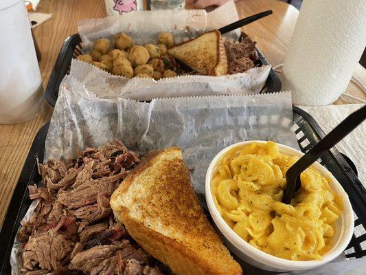 Between the two baskets is a jumbo order of beef brisket. 10oz. of beef, 2 sides and a piece of toast.