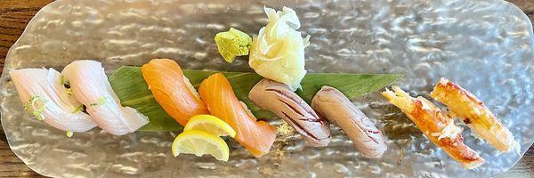 Several nigiri sushis on a beautiful plate