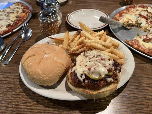 Italian sausage with melted mozzarella cheese on a kaiser roll