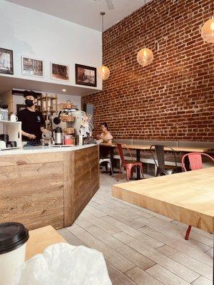 Cute 'n comfy w/plenty of seats for such a tiny cafe - love the brick wall.