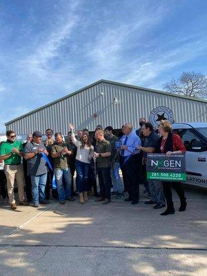 The NXGEN Air & Roofing Team celebrate their Chamber of Commerce ribbon cutting ceremony.