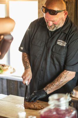 Daryl, Drummin Up BBQ, preparing to serve Tritip.