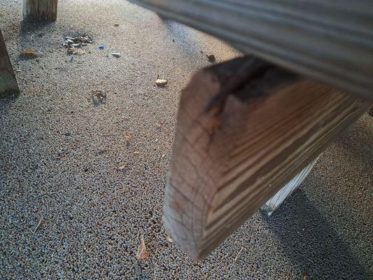 Woodhaven condos rusty nails sticking out on picnic tables. Managed by bosshardt property management.