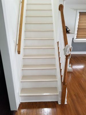 Staircase / Freshly painted stairs and varnished floor.