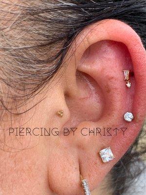 Helix with Yves dangle by Buddha Jewelry Organics and Tragus with triple bead by body gems. All solid gold.