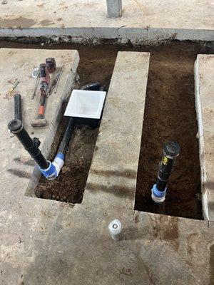 Rough-in plumbing installation for a restaurant, including piping and fixture placement to set up for a smooth and efficient kitchen.