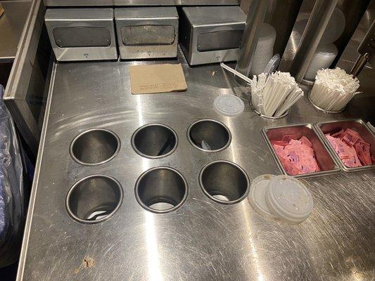 Dirty counter and empty utensils and napkins