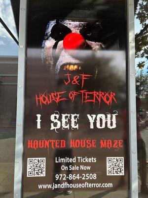 a poster outside the  haunted house