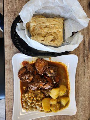 Channa and aloo, stew chicken and buss up shot.