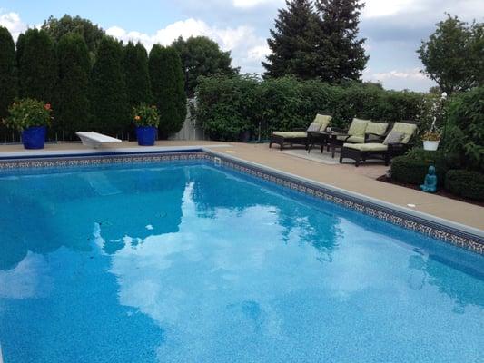 Custom Pool with auto cover by Caribbean Pools.