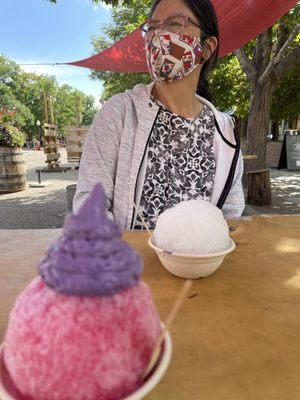 Shaved ice with ube foam and azuki beans in the bottom.