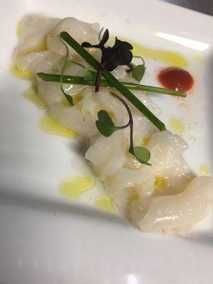 Scallop ceviche with micro greens and a truffle shirrachi