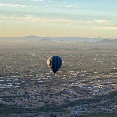 Two other balloons with the morning sky