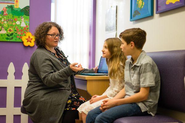 Dr. Sharlene Matthieu, pediatrician in Portland, educating patients during a visit.