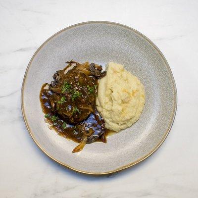 Bison Salisbury Steak with Mushroom Gravy and Onion Confit Cauliflower Mashers