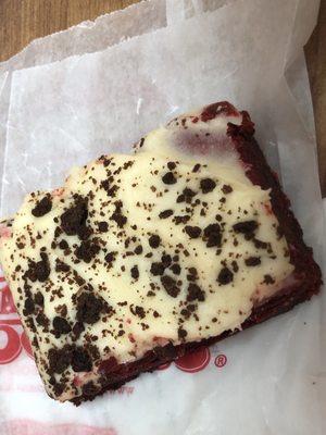 Red velvet brownie with cream cheese frosting.