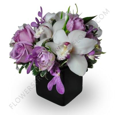 Orchids and lavender roses...romantic, elegant and tasteful all in one design.