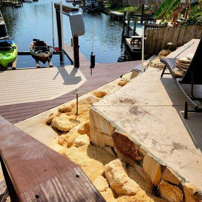 Crushed Coquina and Coquina Boulder sea wall installation.