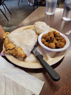 Chicken fried steak, fried okra, mashed potatoes.