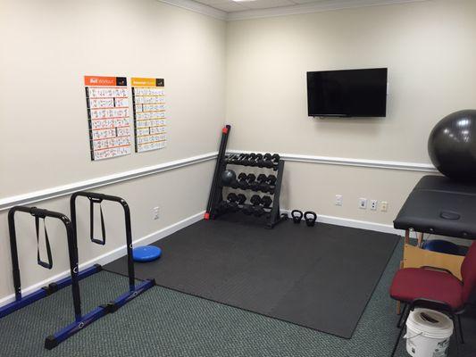 Dip station, weights of all kinds, kettle bells, training/rehab table. Everything we need to get you out of pain and back in the game.