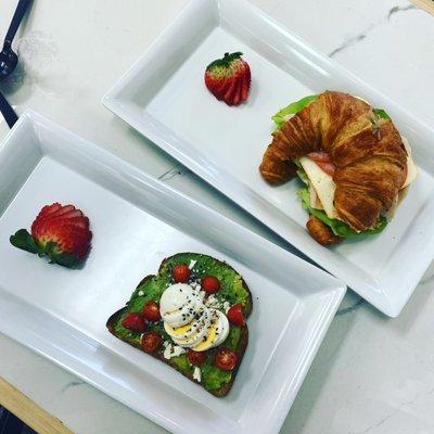 Avocado toast with cherry tomatoes and feta cheese turkey cranberry croissant.