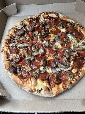 New Yorker Thin Crust Pizza with pepperoni, Italian sausage. And mushrooms