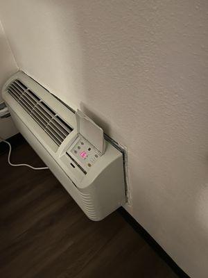 AC falling off wall